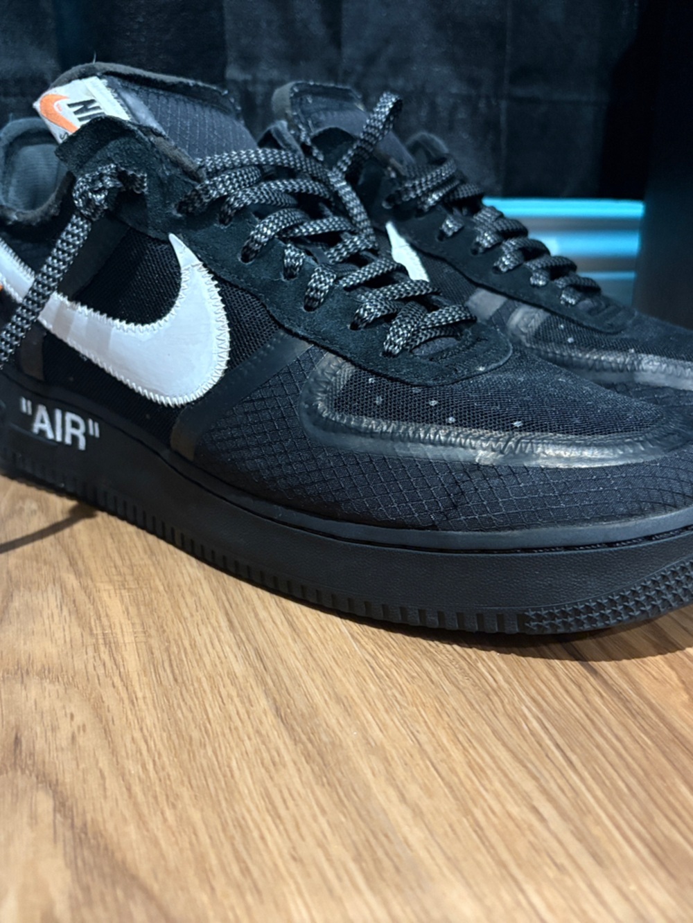 Off-White Black Low-Top Sneakers with White Swoosh and Orange Tongue Tab